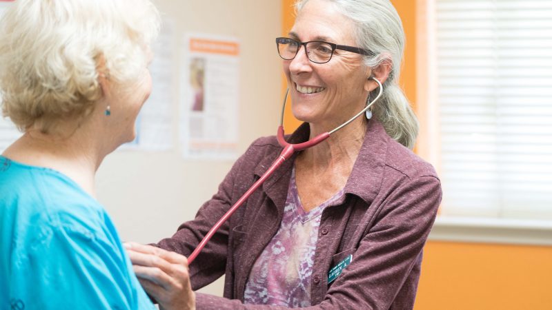 doctor examining patient